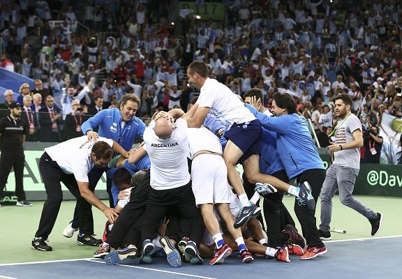 Tennis - Croatia v Argentina - Davis Cup Final - Arena Zagreb, Croatia - 27/11/16 Argentina's Federico Delbonis reacts with his team after winning against Croatia's Ivo Karlovic.      REUTERS/Antonio Bronic